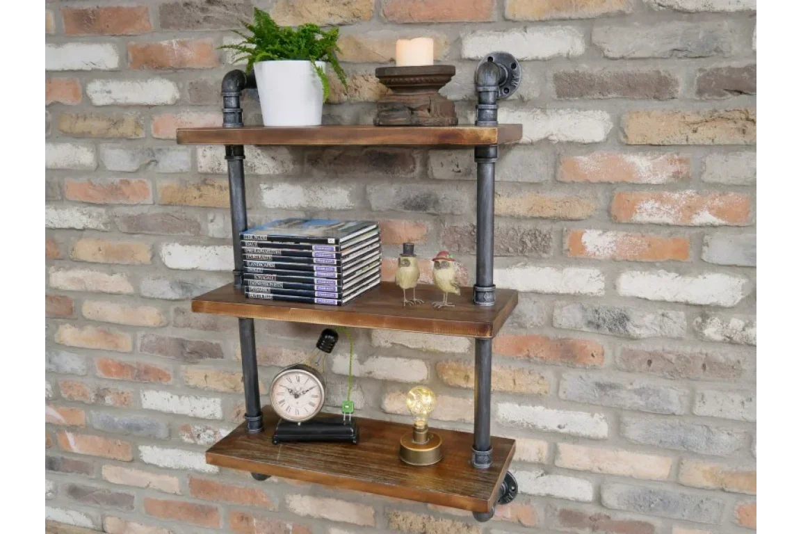 Industrial wall shelf with three wooden tiers and black metal pipes on brick wall