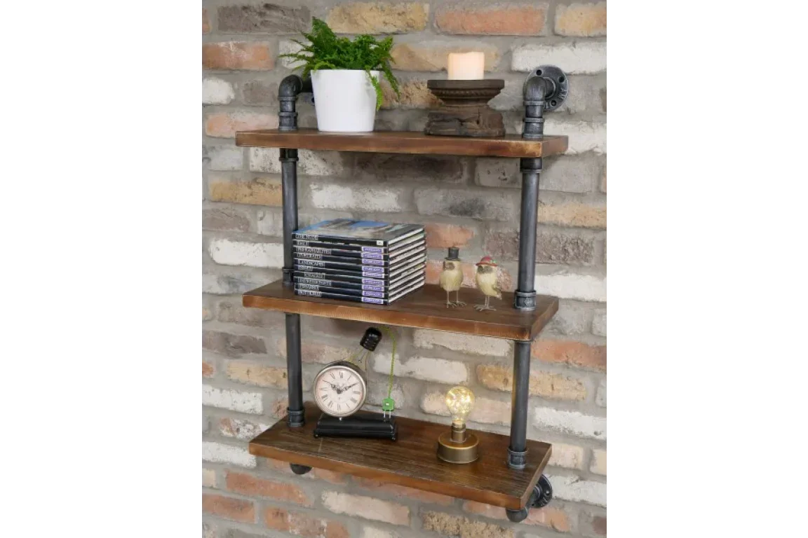 Industrial wall shelf with black metal pipes and wooden shelves on a brick wall