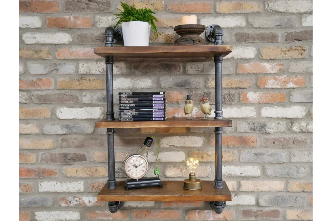 Industrial wall shelf unit with wooden shelves and black pipe frame against brick wall