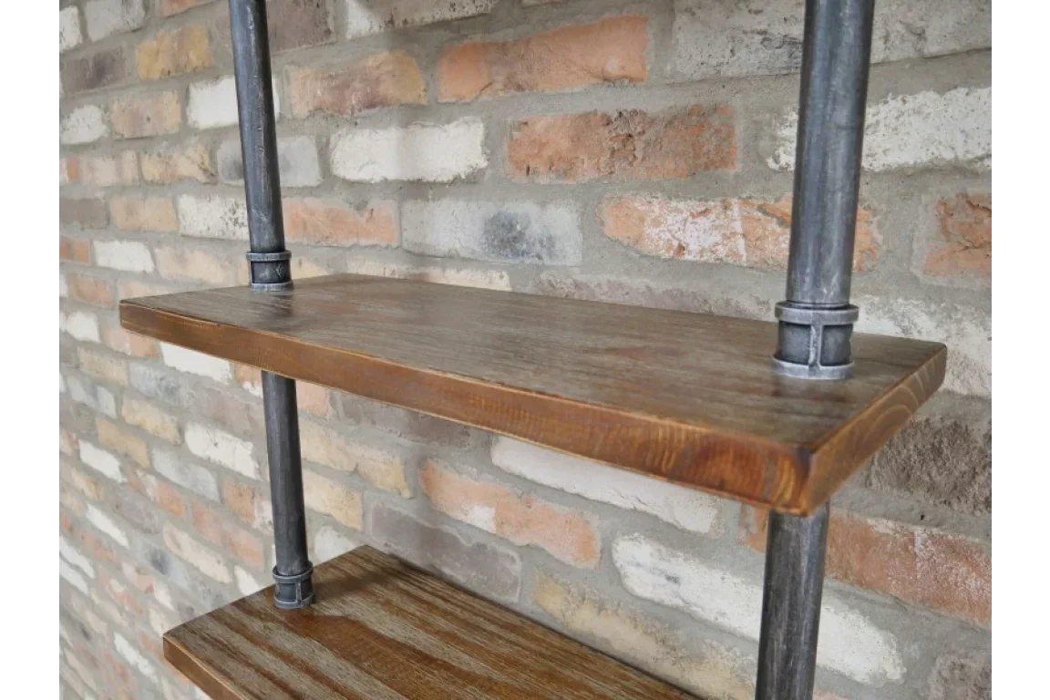 Industrial wood and metal shelving unit against exposed brick wall