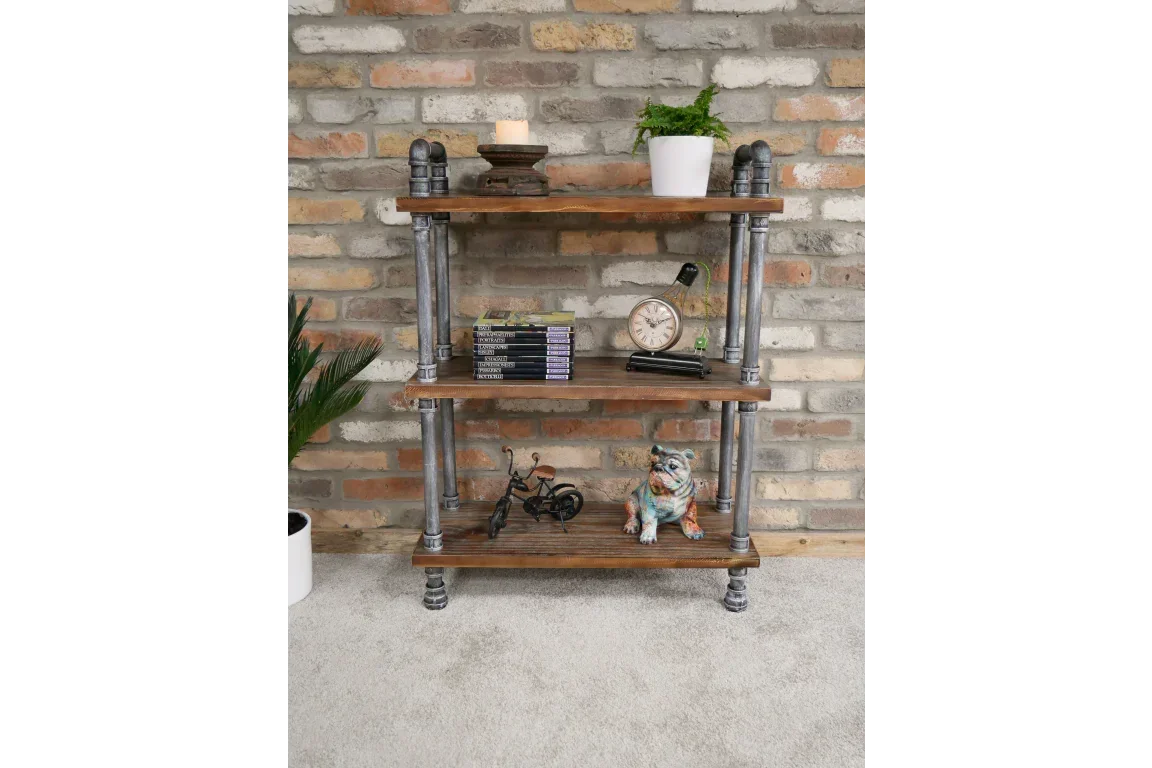 Industrial style wooden shelf unit with metal frame against brick wall, decorated with plants