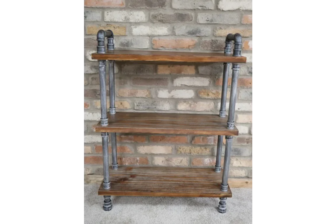 Industrial shelving unit with three wooden shelves and metal pipe frame against brick wall
