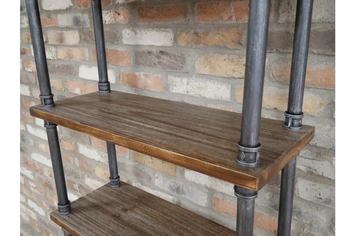 Industrial wood shelving unit with metal pipe frame against exposed brick wall
