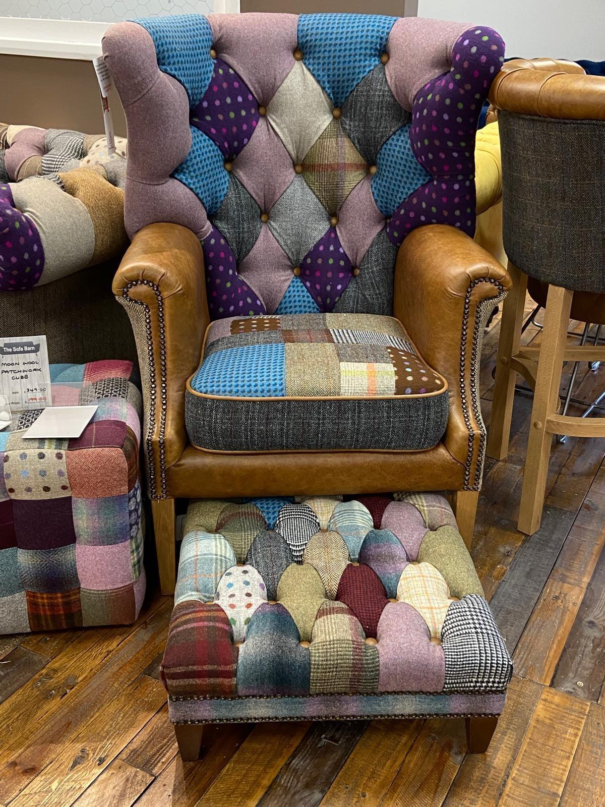 Patchwork armchair with leather arms and matching footstool on wooden floor