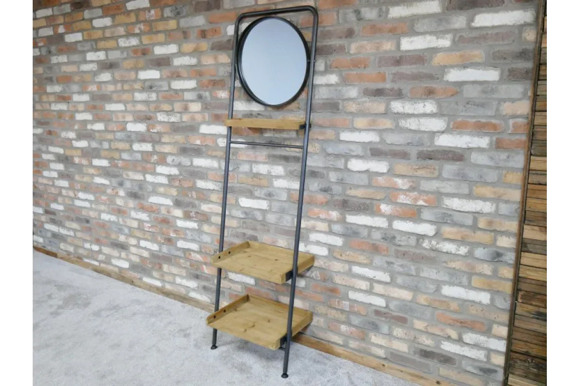 Industrial ladder shelf with round mirror and wood shelves against exposed brick wall