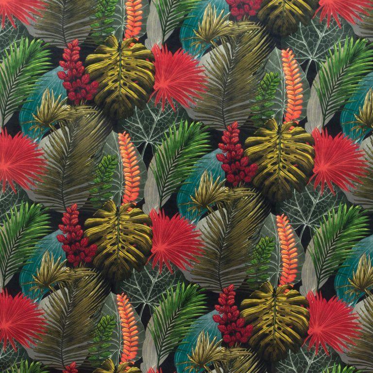 Tropical leaf print upholstery fabric with red, green, and gold foliage pattern