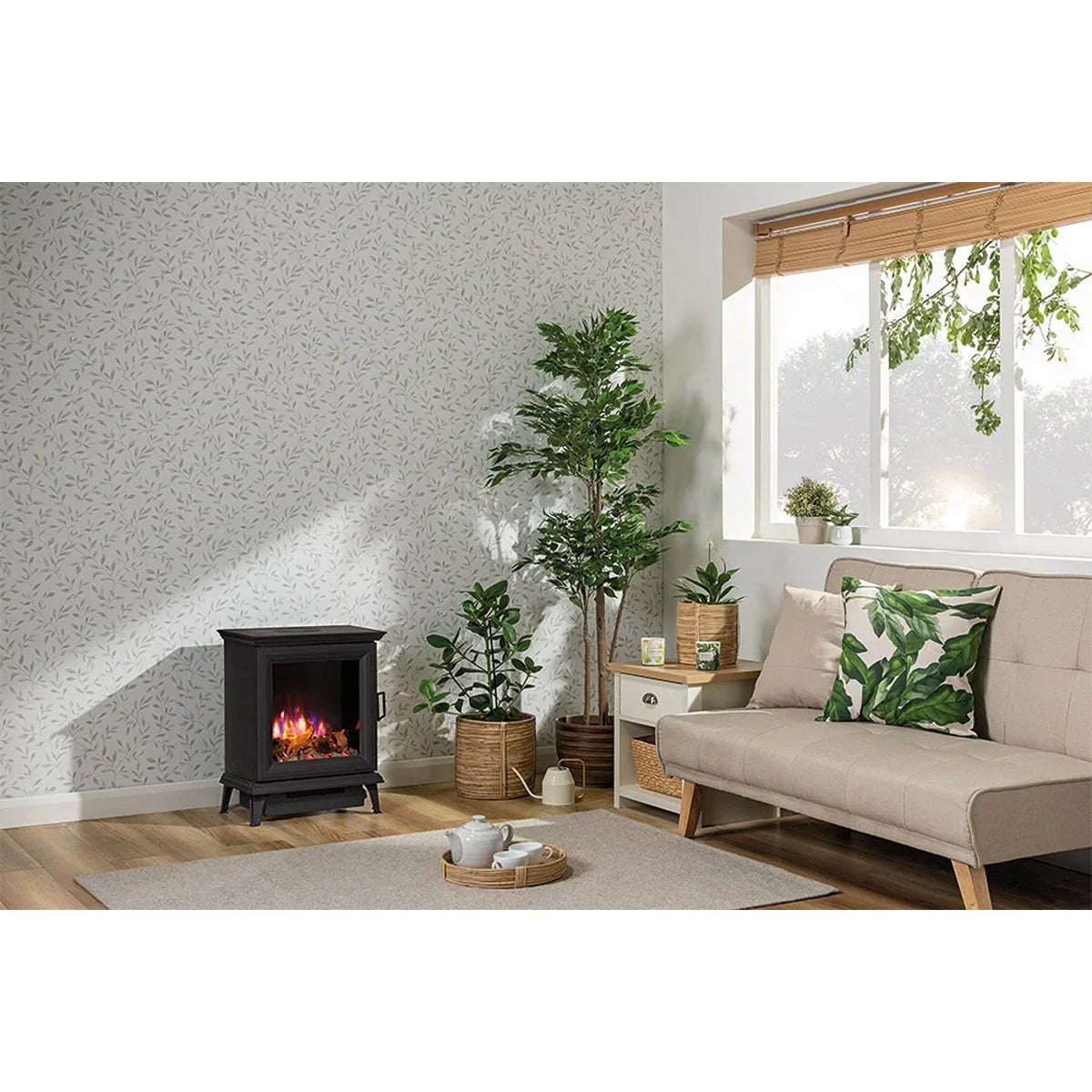 Electric stove heater in modern living room with sofa, plants, and patterned wallpaper
