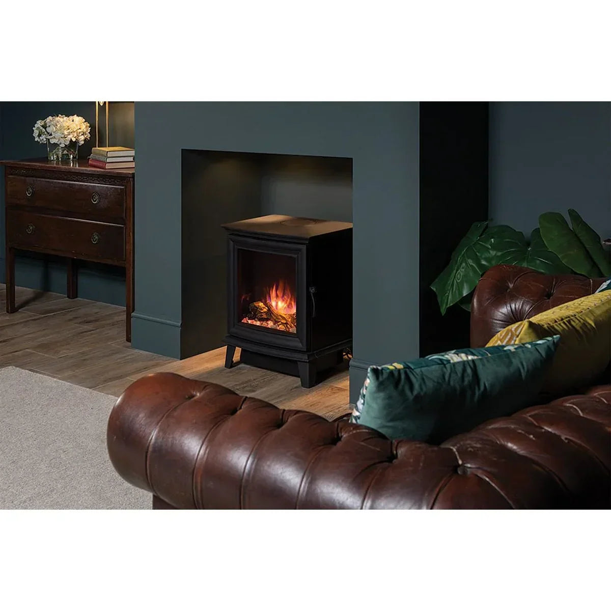 Electric stove heater with flame effect in modern living room with brown leather sofa
