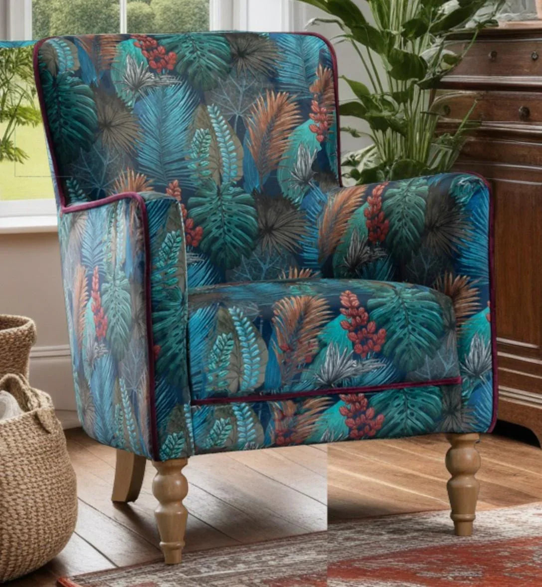 Tropical print accent armchair with wooden legs in a living room setting