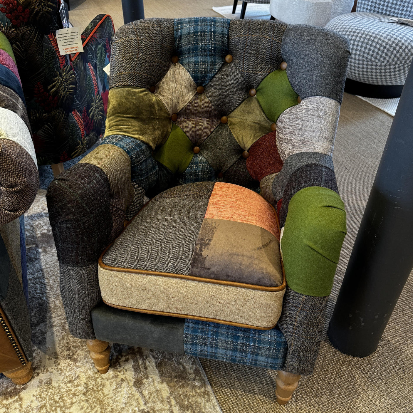 Patchwork armchair with button-tufted back, mixed fabric upholstery and wooden legs