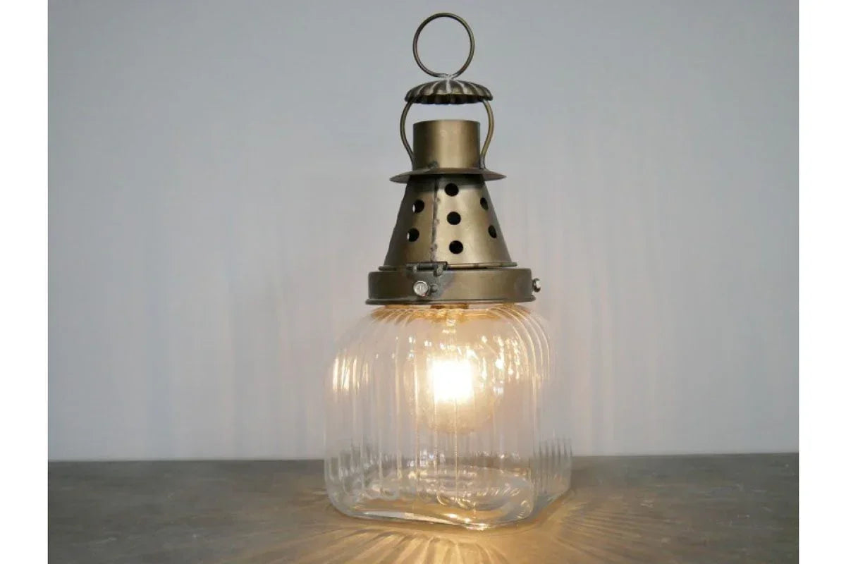 Vintage brass and glass lantern table lamp with ribbed clear base and metal top