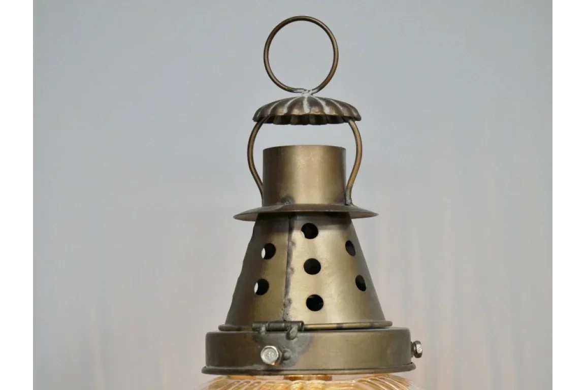 Brushed brass pendant light top with vented metal shade and ring handle detail