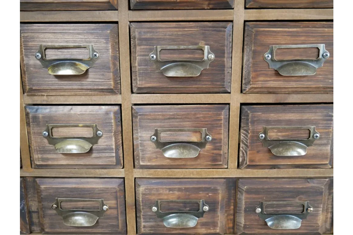 Dark wood cabinet with multiple small drawers, brass handles and label holders