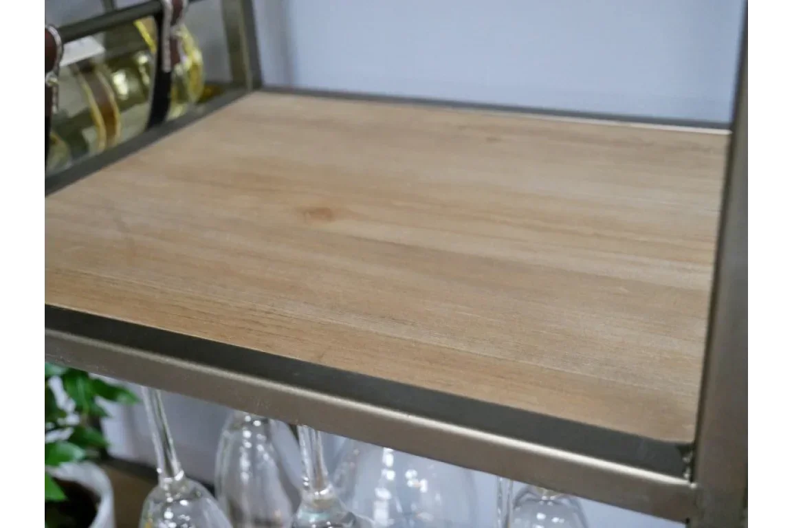 Light wood shelf with metal frame and hanging wine glasses underneath