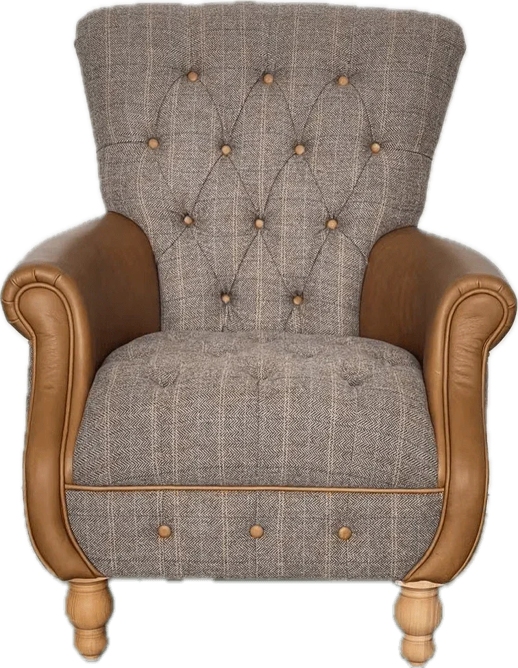 Button-tufted armchair with grey herringbone fabric and tan leather arms and wooden legs