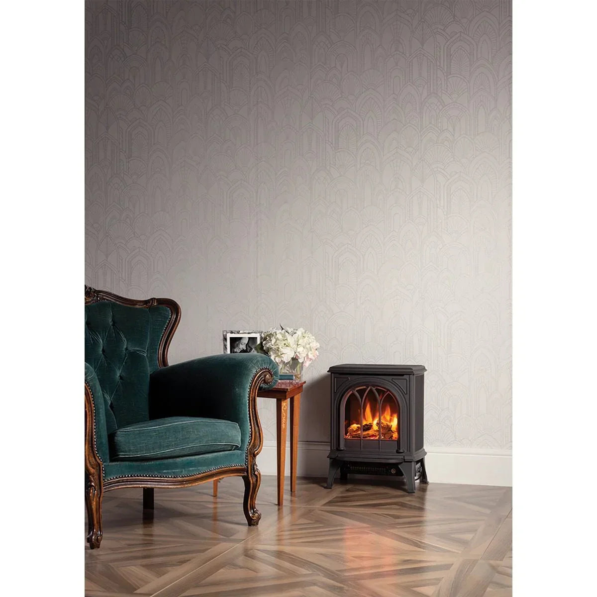 Electric stove heater beside teal armchair and wooden side table in living room