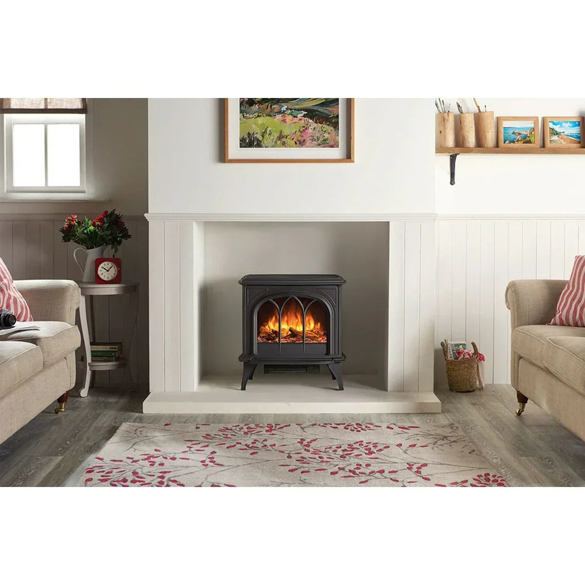 Black electric stove heater with flame effect in a bright modern living room setting