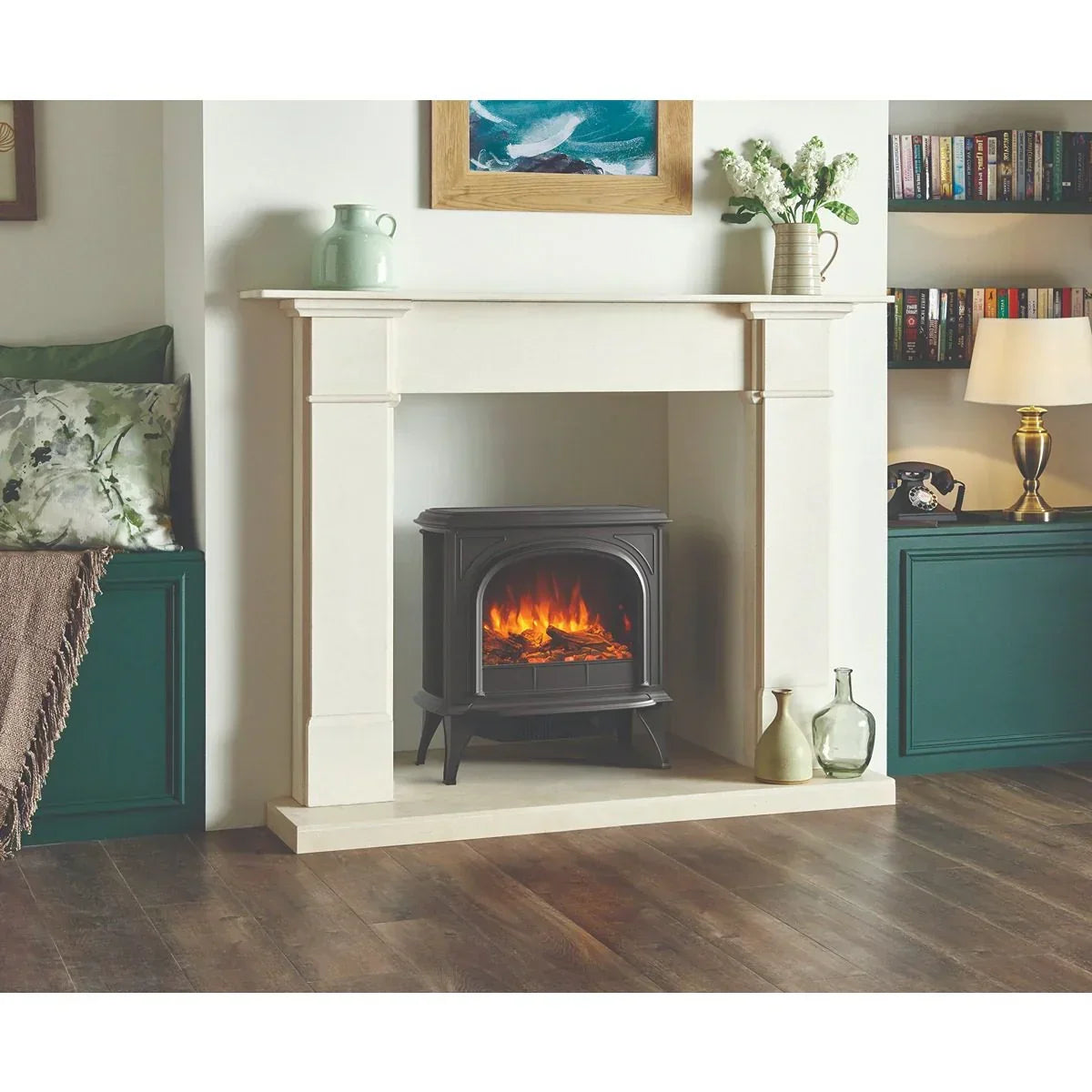 Electric stove heater with realistic flame in cream fireplace surround on wooden floor
