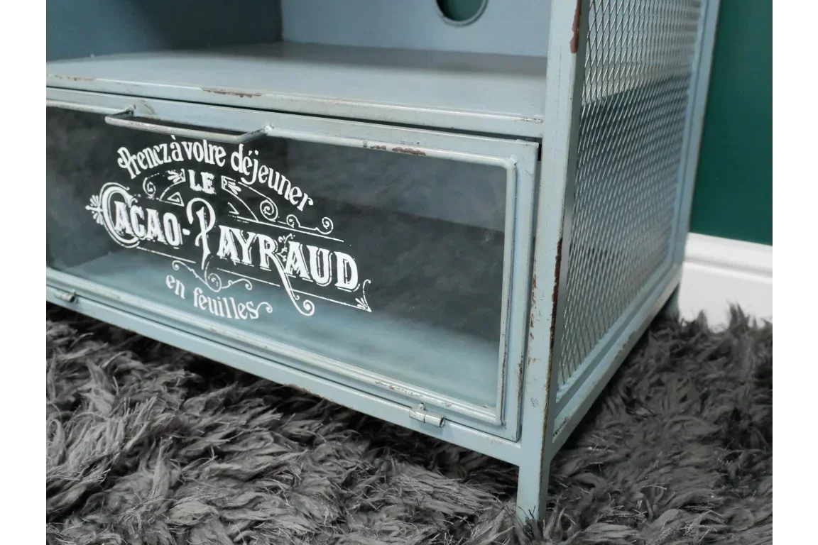 Vintage style metal storage cabinet with mesh side and glass door featuring French typography