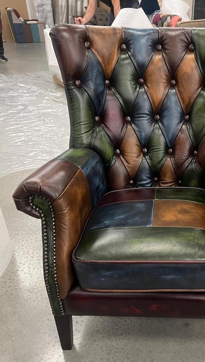 Multicoloured patchwork leather armchair with button tufted back and studded armrest
