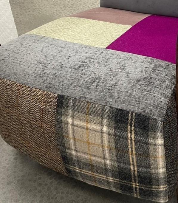 Patchwork fabric ottoman with grey, plaid, herringbone, cream and purple upholstery