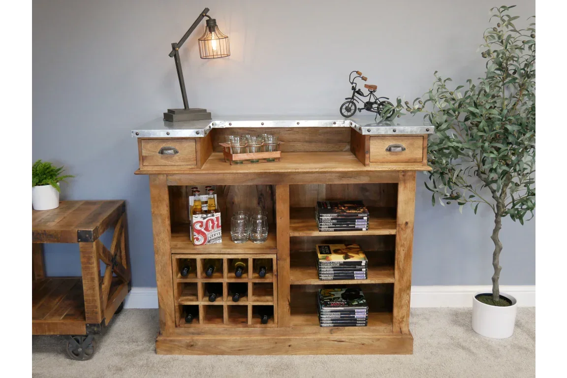 Rustic wooden bar cabinet with wine rack, shelves, drawers and metal top in living room
