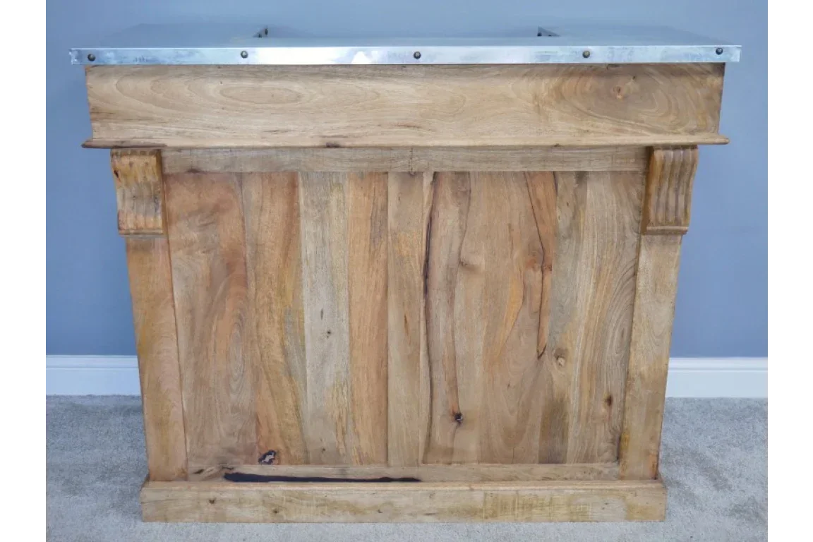 Natural wood bar counter with metal top and carved column accents, front view