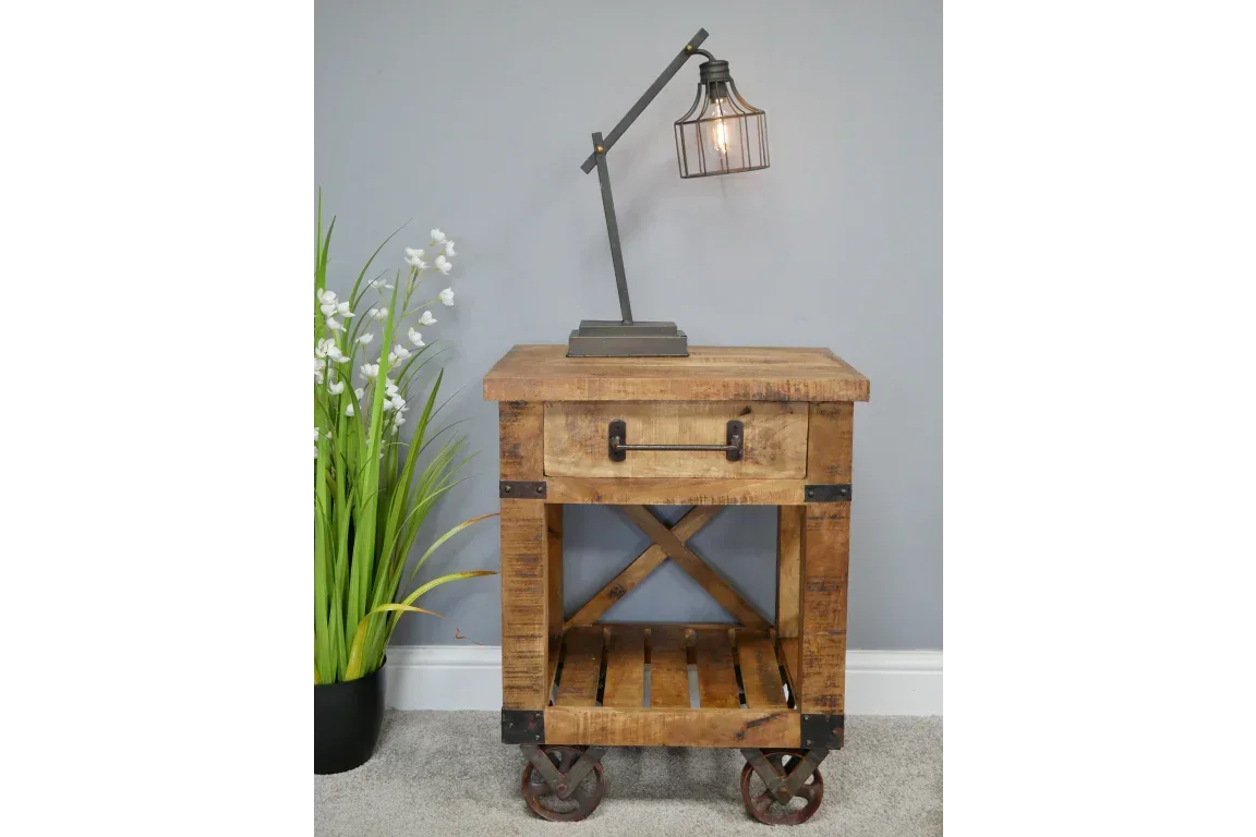 Rustic wooden bedside table with drawer, open shelf, metal accents and caster wheels