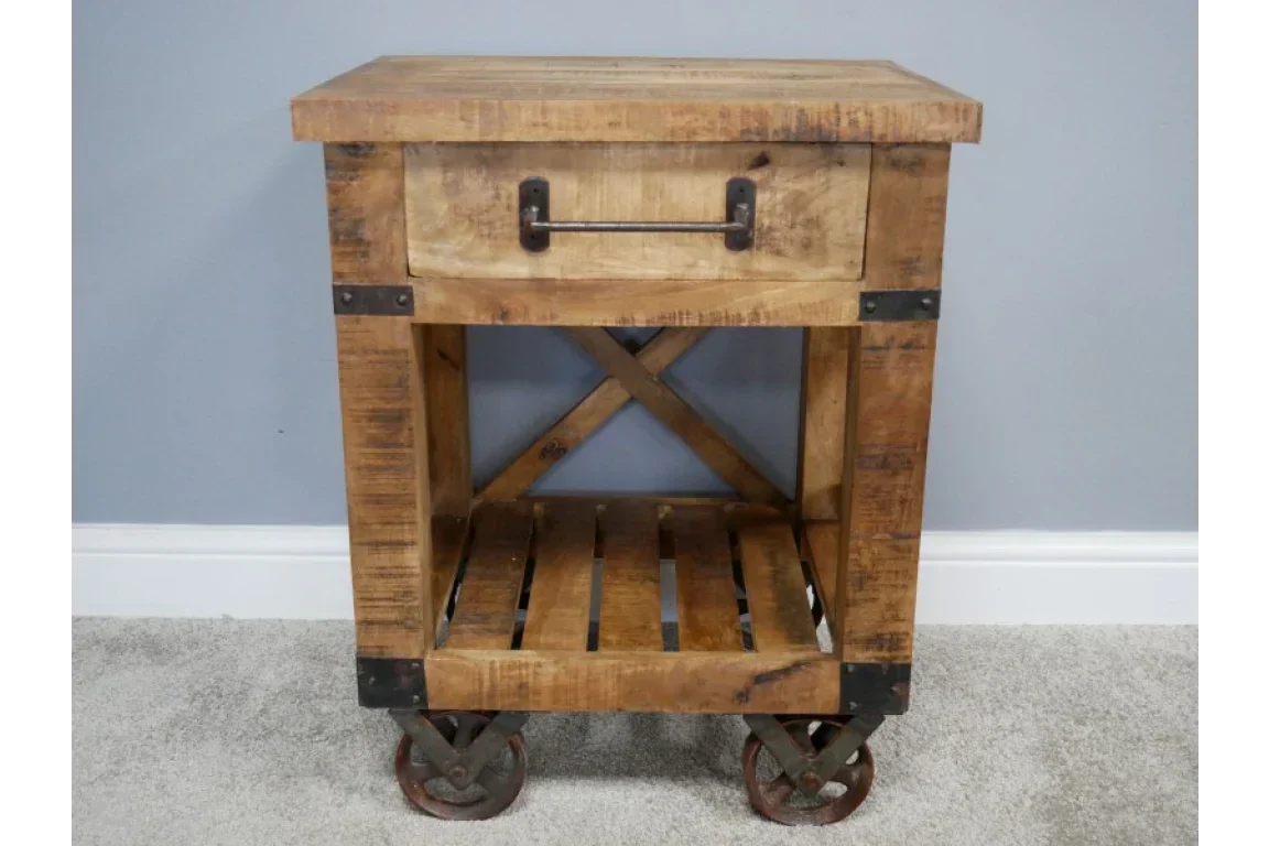 Rustic wood side table with metal drawer handle, lower slatted shelf and castor wheels