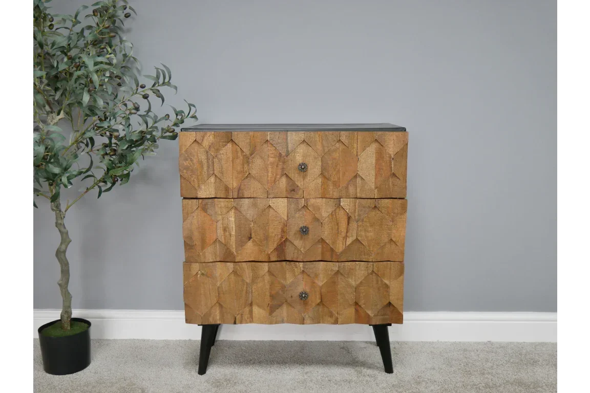 Geometric wood chest of drawers with three drawers and black legs against grey wall