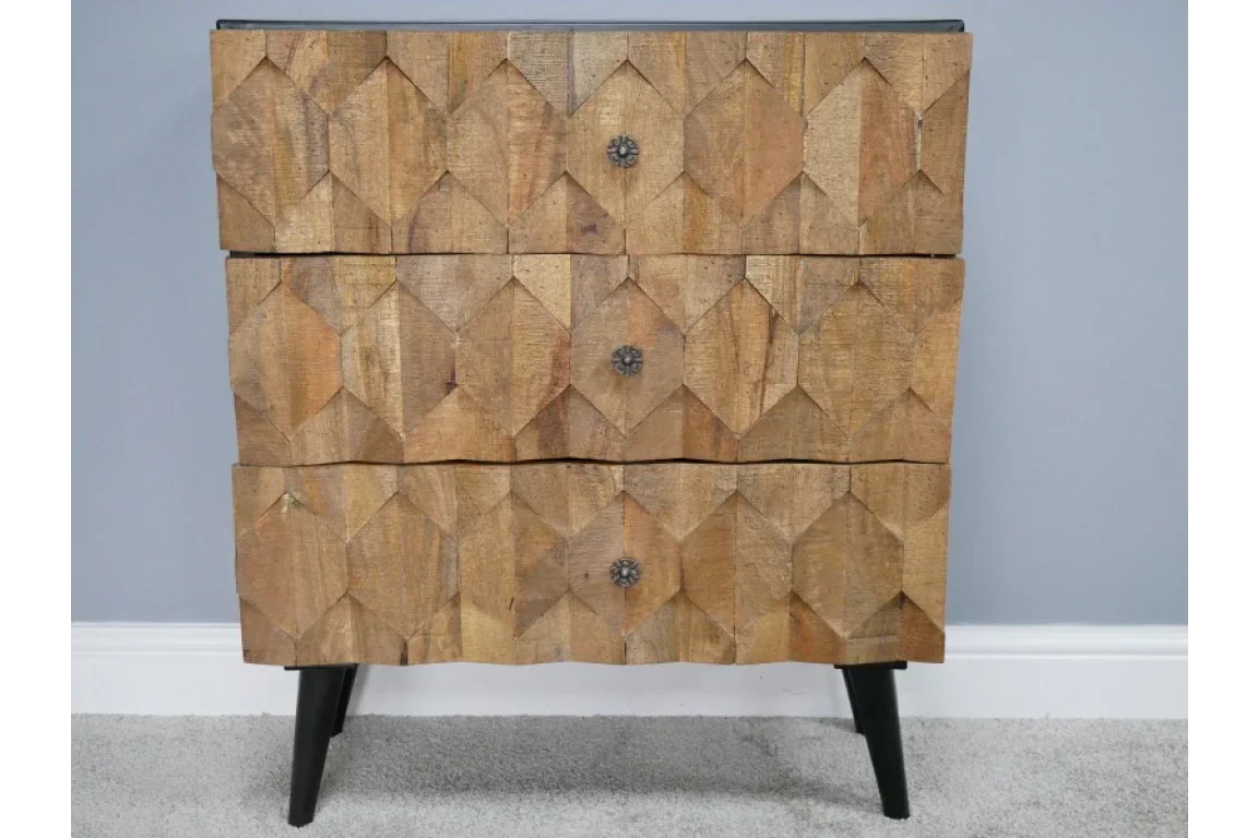 Mango wood chest of drawers with geometric carved front and black angled legs