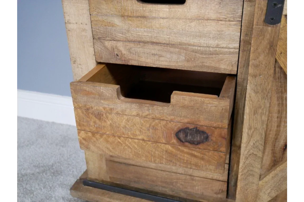 Close-up of rustic wooden drawer unit with open storage drawer and natural finish