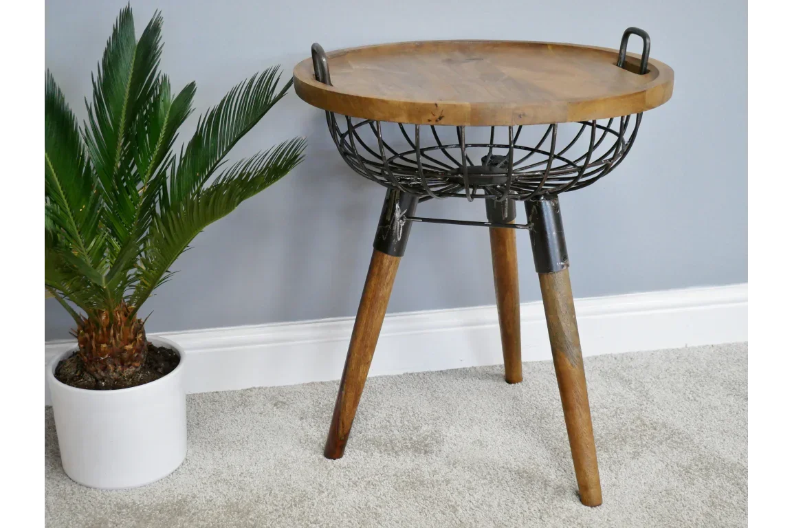 Round industrial side table with wooden top, metal basket frame and three wooden legs