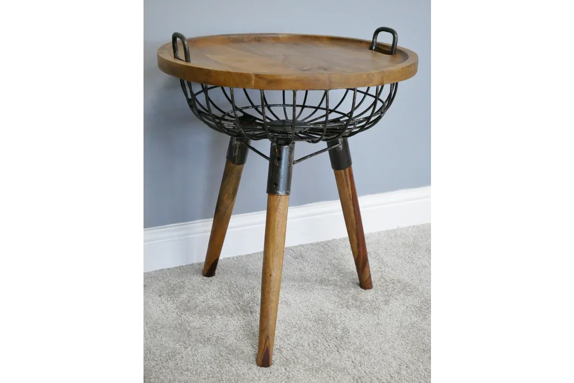 Round side table with wooden top, metal basket detail, and three wooden legs