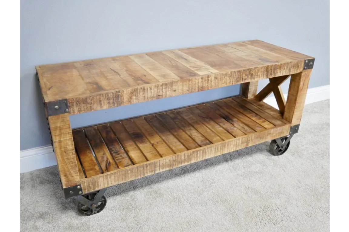 Industrial wooden console table with metal wheels and lower slatted shelf against grey wall