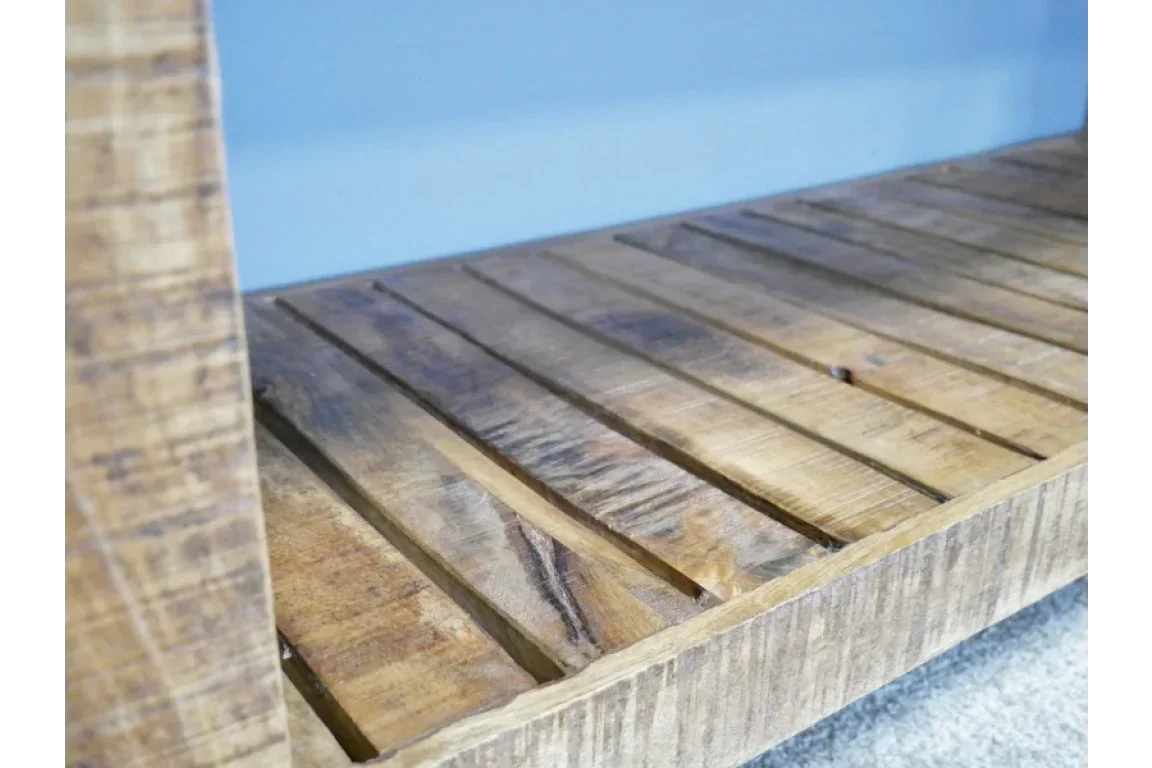 Closeup of slatted wooden shelf detail with natural grain and rustic finish