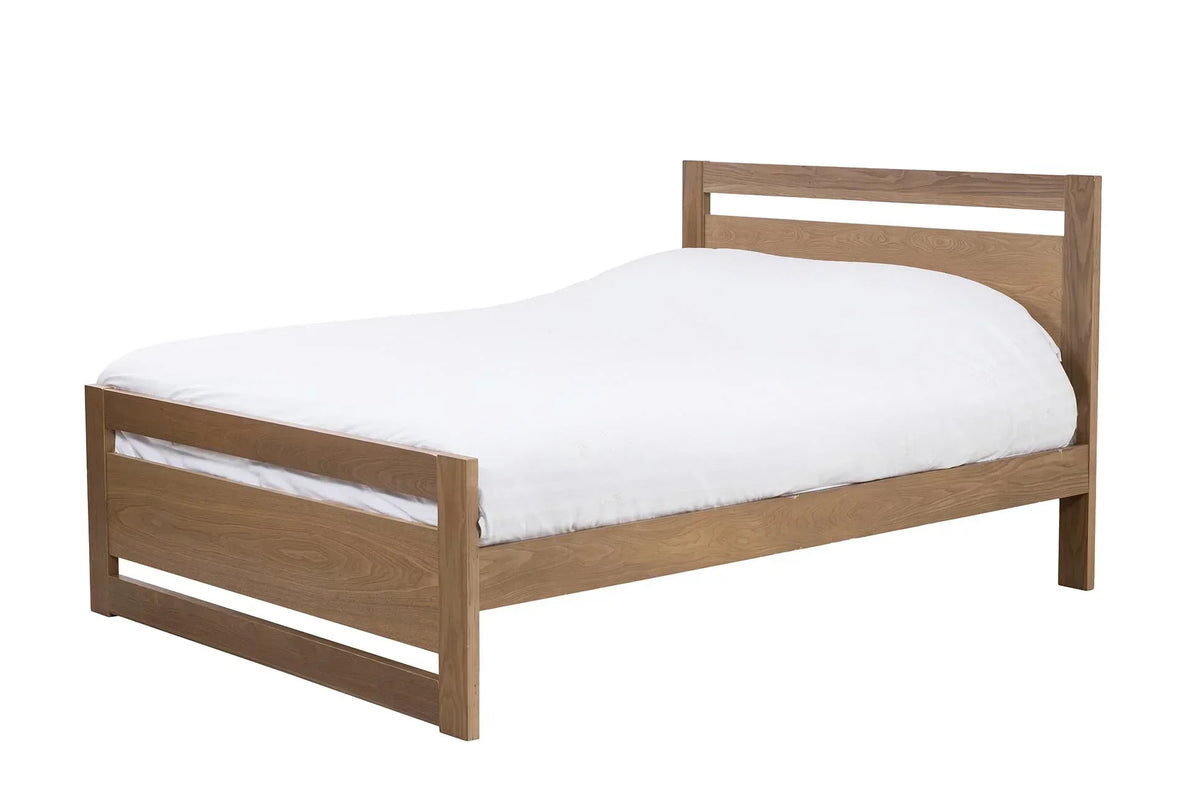Oak wooden bed frame with vertical slat headboard and white bedding