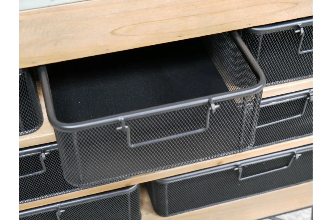 Black metal mesh storage drawers in wooden unit, front view highlighting pull handles