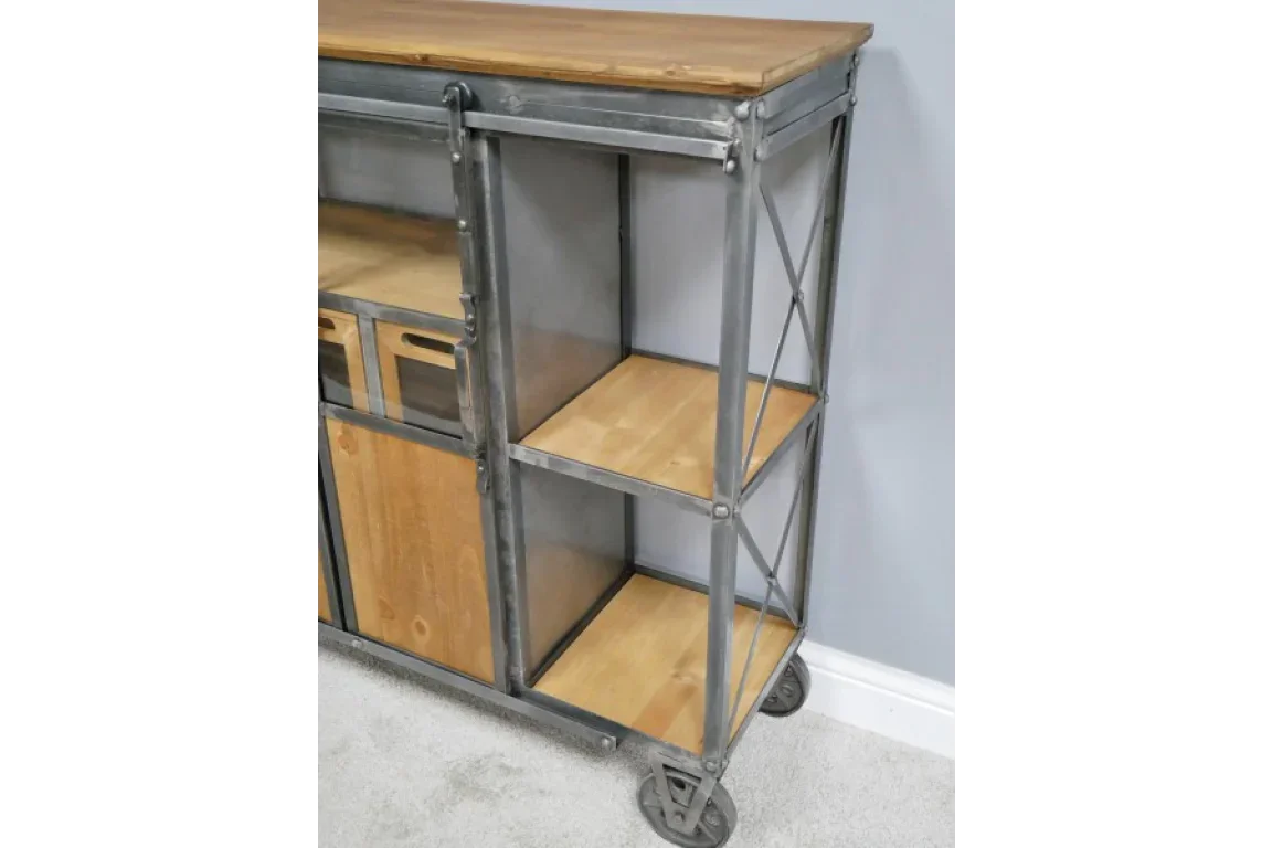 Industrial storage unit with metal frame, wood shelves, and wheels against a grey wall