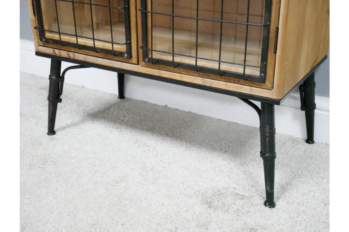 Industrial sideboard with black metal legs and wire-front wooden cabinet doors on carpet