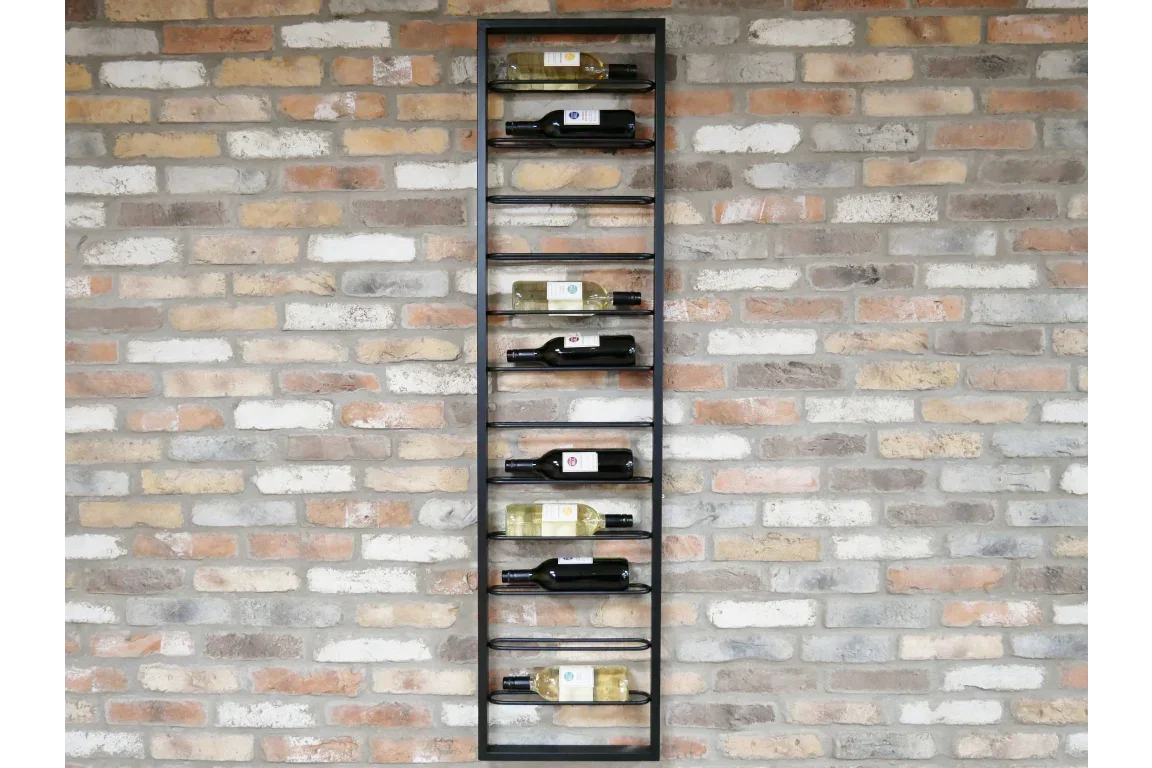 Black metal wall mounted wine rack holding eight bottles on exposed brick wall