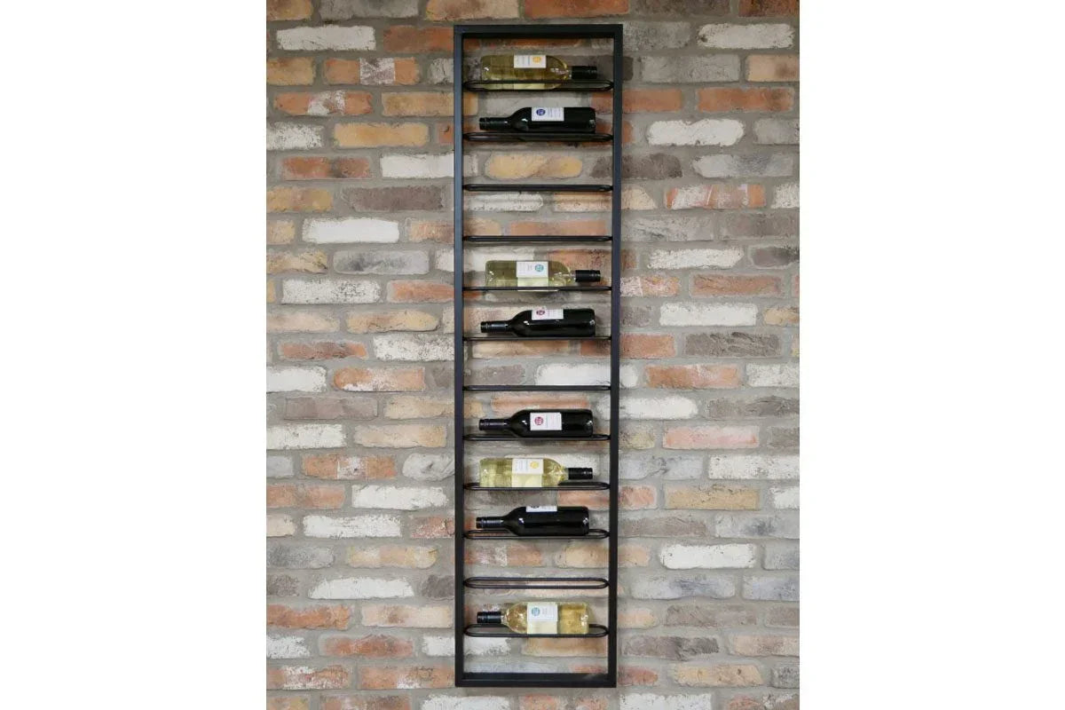 Wall-mounted metal wine rack holding bottles against exposed brick wall