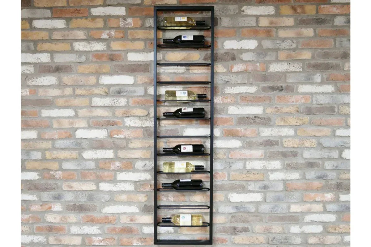 Wall mounted metal wine rack with eight bottles against exposed brick wall