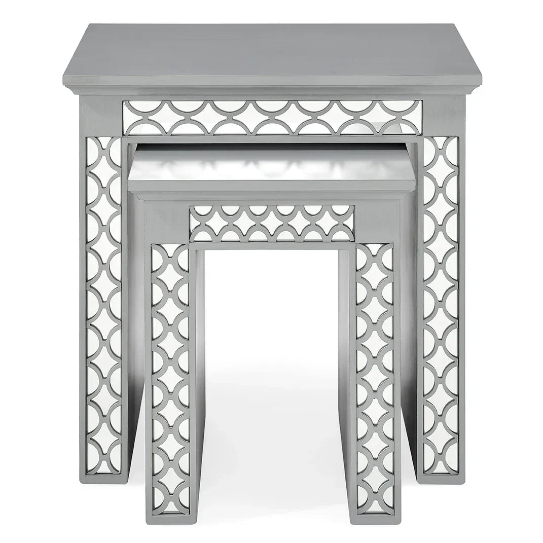 Grey wooden nest of tables with geometric cut-out sides, two tables stacked together