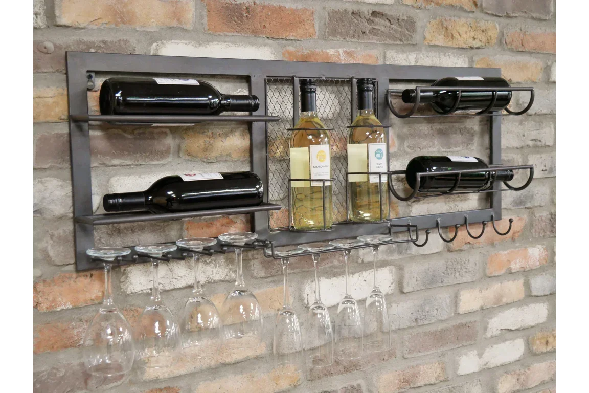 Wall mounted metal wine rack with glass holders and bottles on exposed brick wall