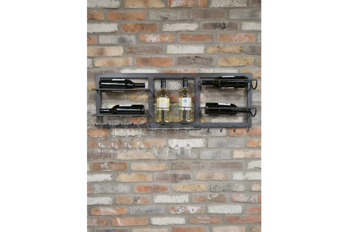 Wall mounted wine rack with glass holders and six wine bottles on brick wall
