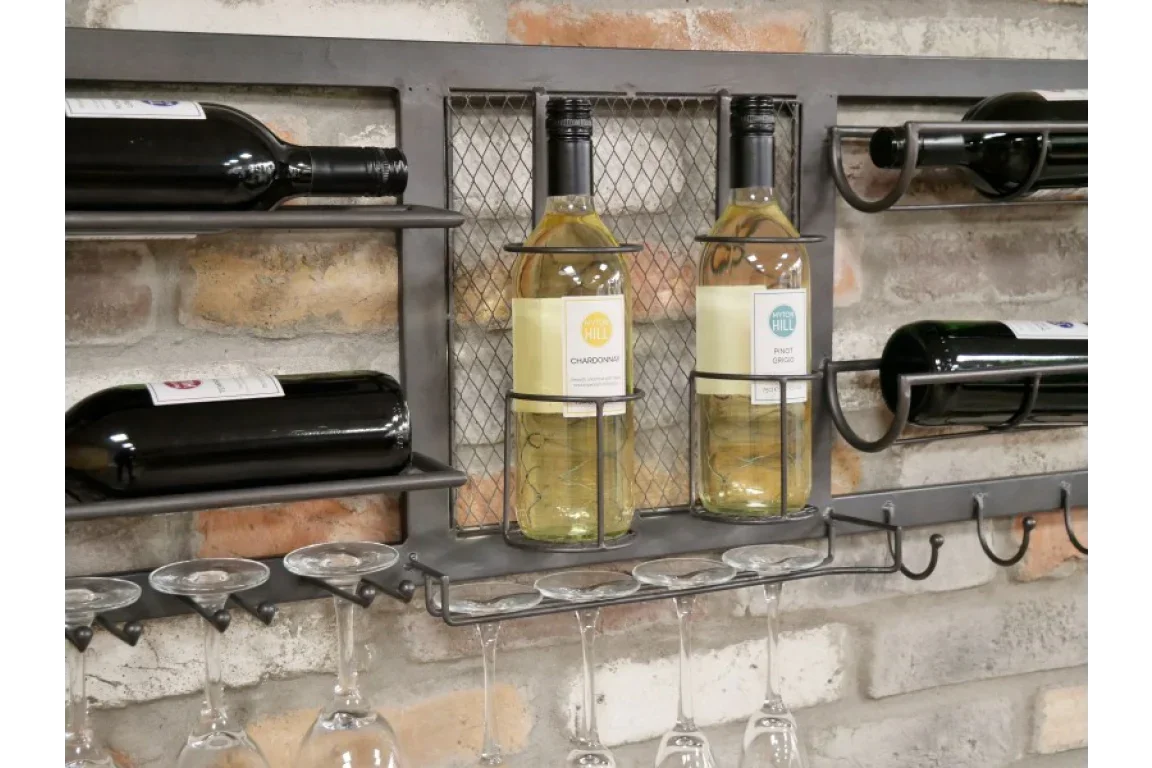 Wall mounted metal wine rack with four wine bottles and hanging wine glasses