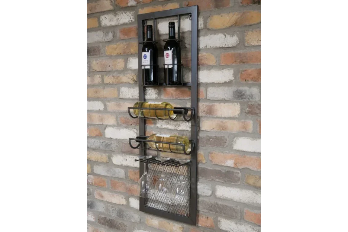 Wall mounted metal wine rack holding bottles and glassware against brick wall