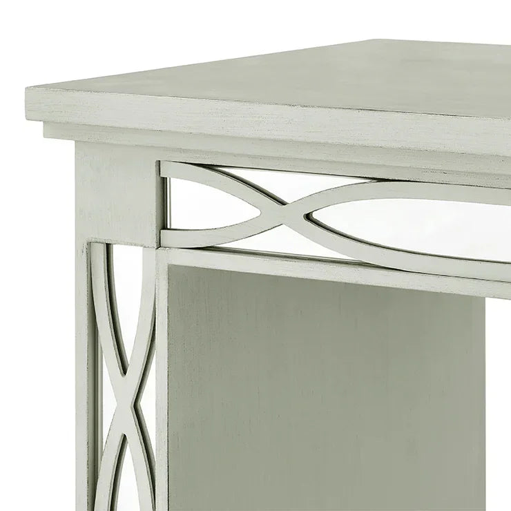 Silver wood side table with decorative lattice panel, corner view