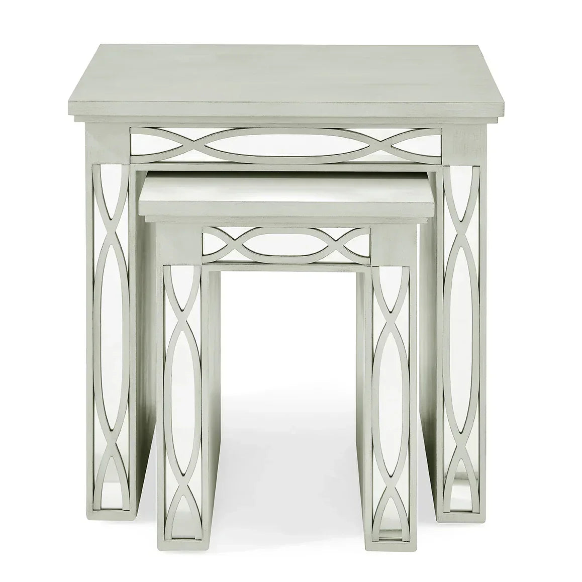 Set of two silver mirrored nesting tables with decorative geometric side panels